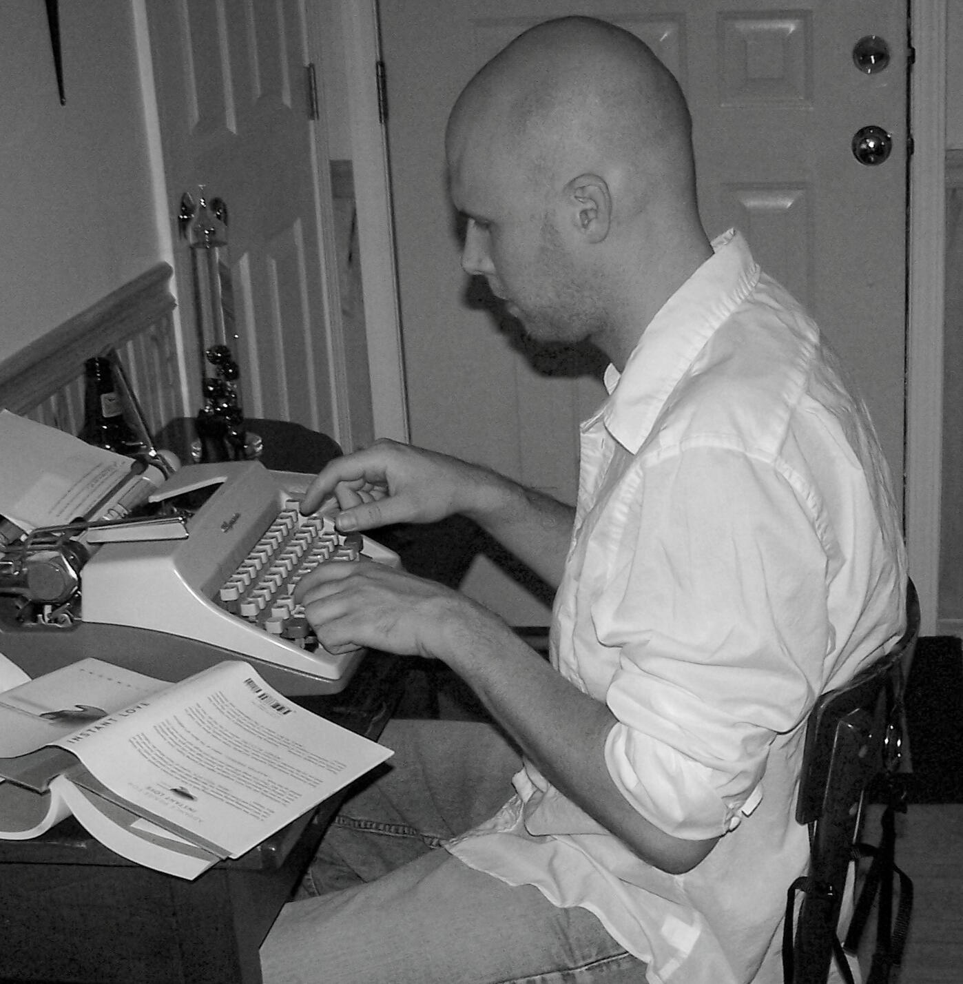 Keck Sitting at Typewriter
